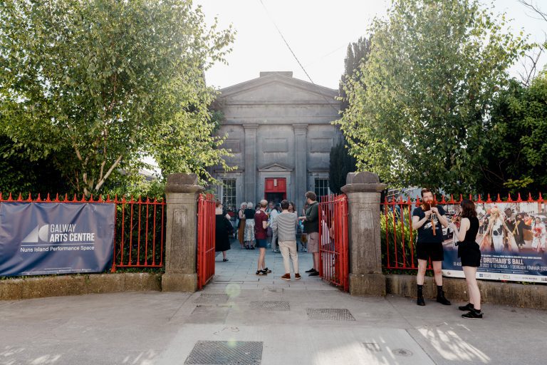 Entrance to event space with people gathering outside